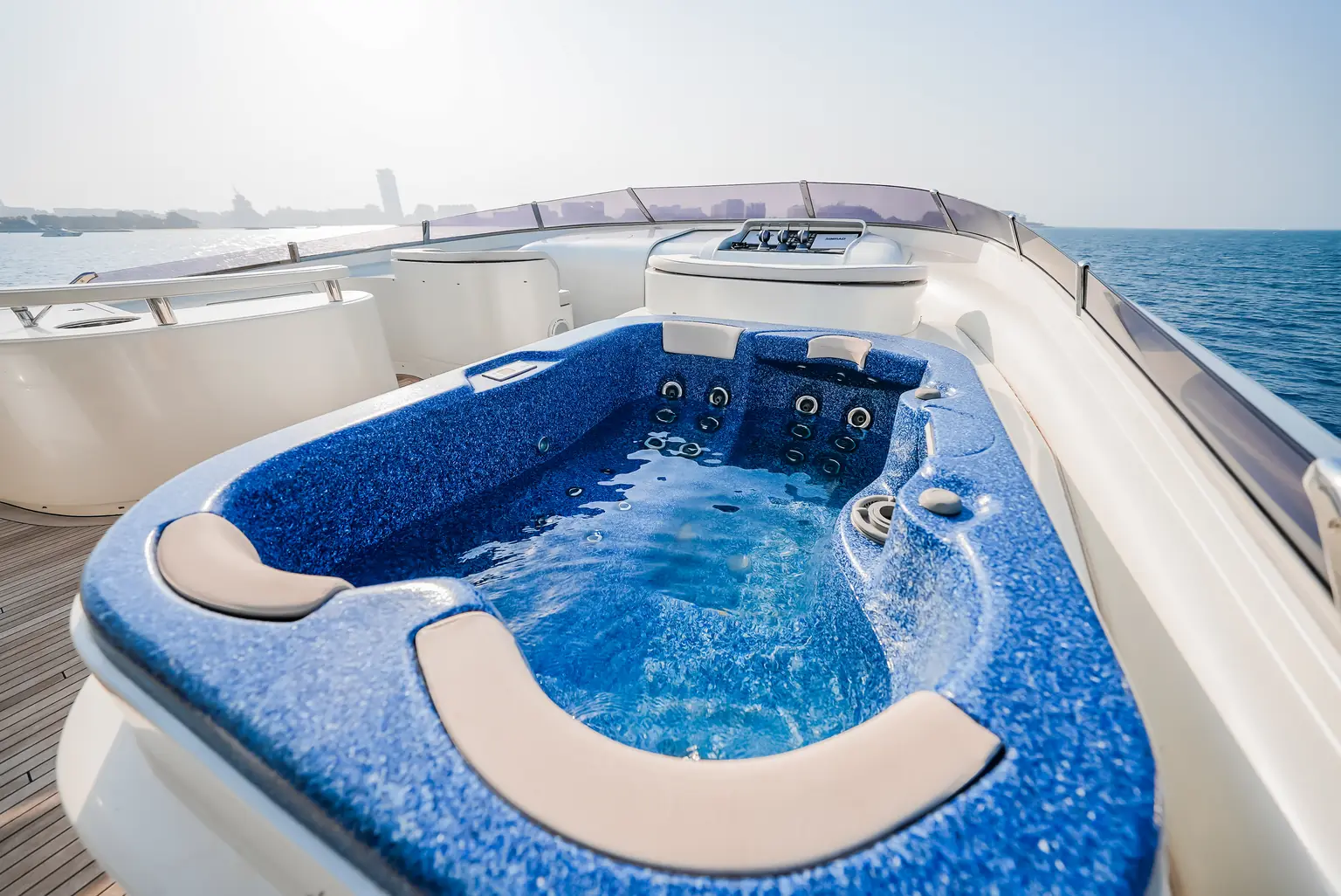 Jacuzzi set into the upper deck with seating around the rim