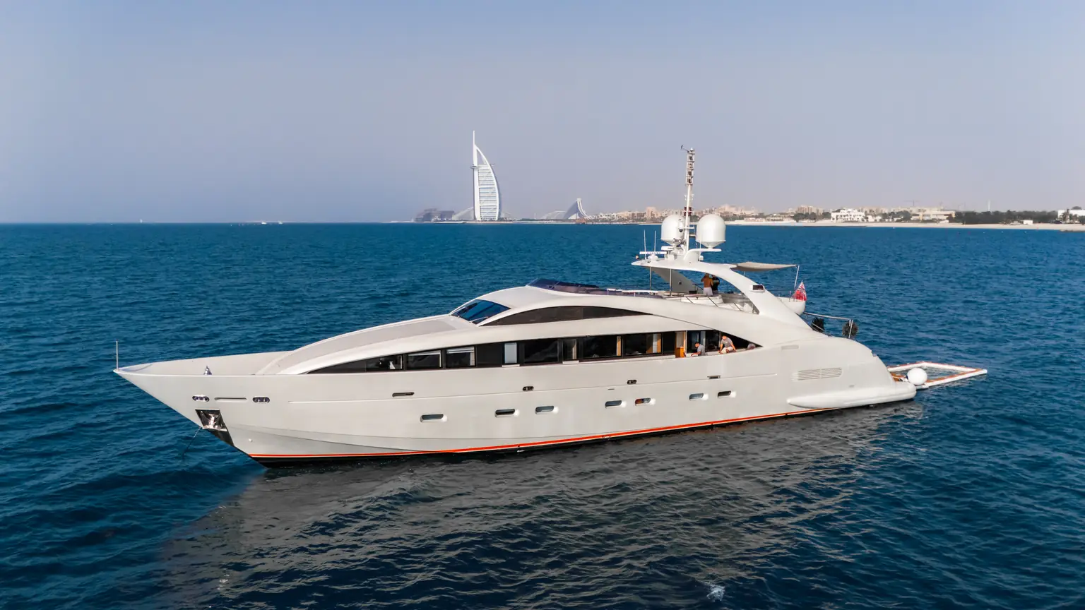Plan B of Freedom under way off Dubai with the Burj Al Arab on the horizon